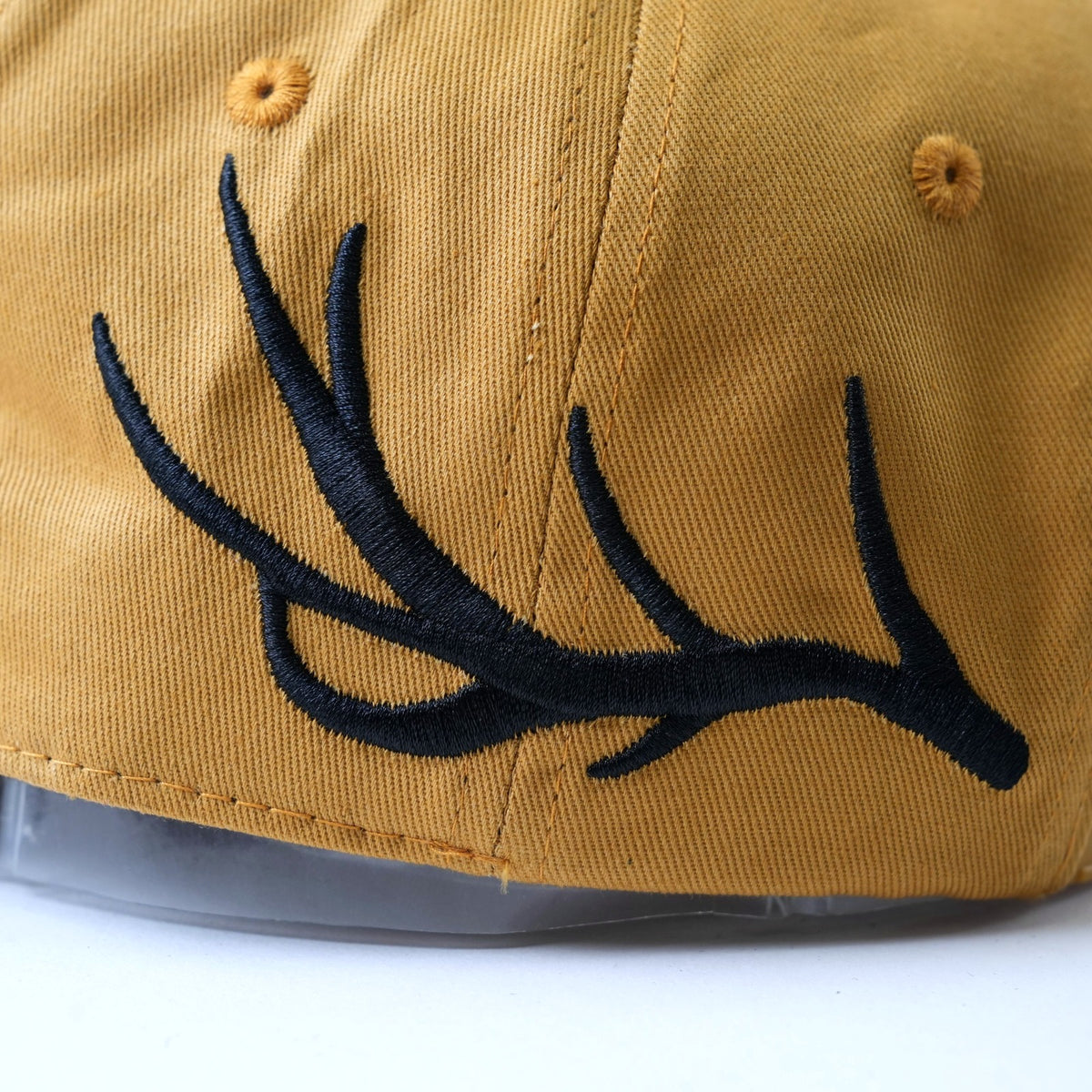 Close up of the black antler embroidery on the Timber Buck Hat